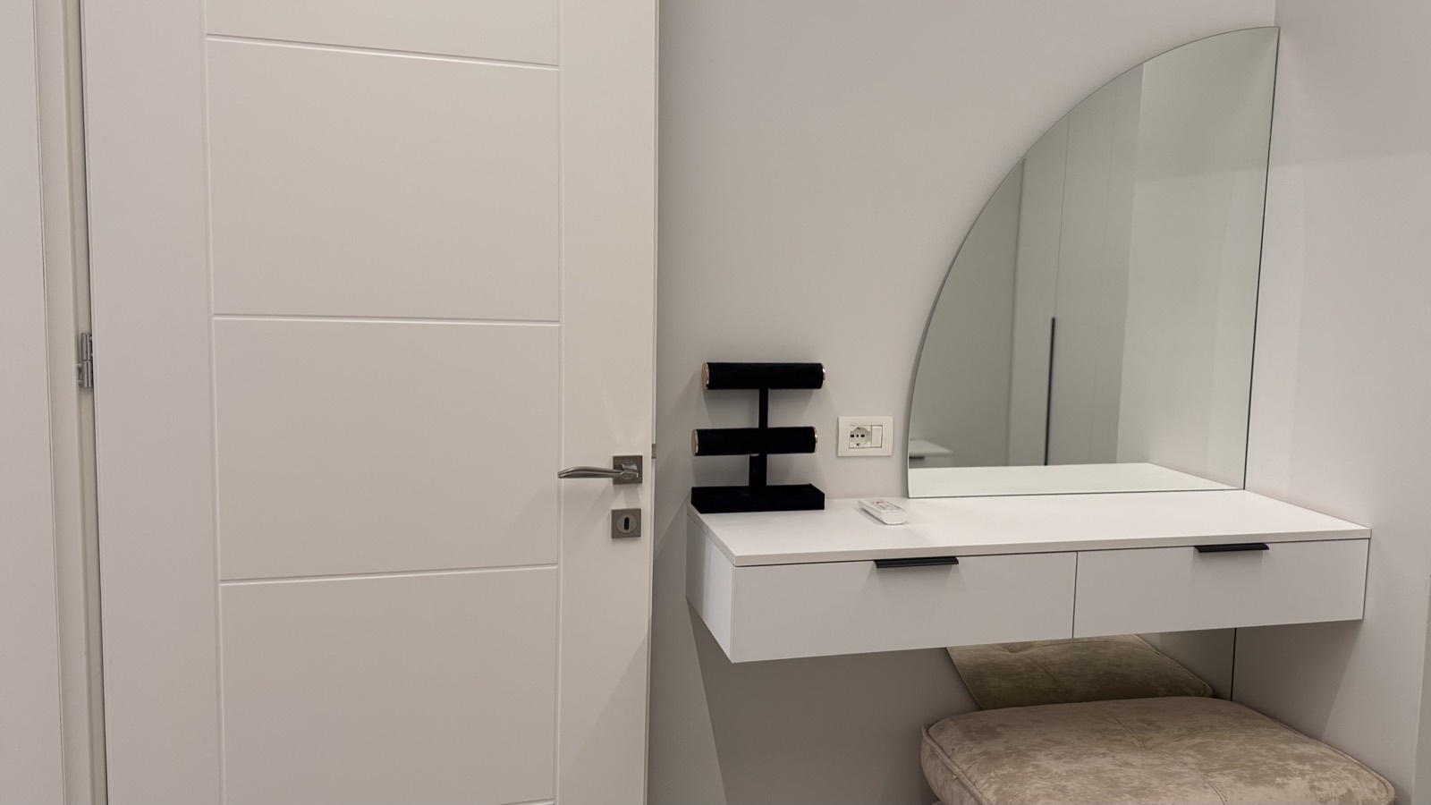 Floating vanity with arched mirror